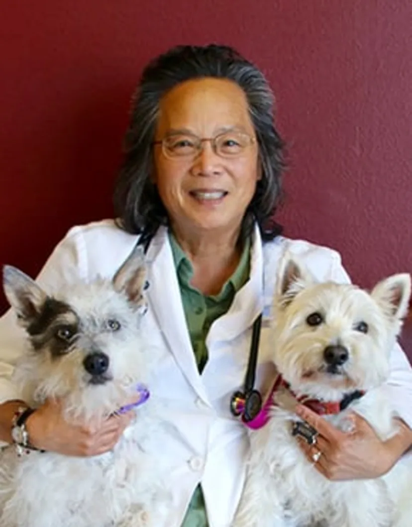 Dr. Barbara Lee holding two dogs